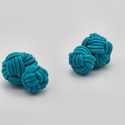 CUFFLINK SILK KNOT, BIG & SMALL DUAL FIST UNI-COLOR TURQUOISE